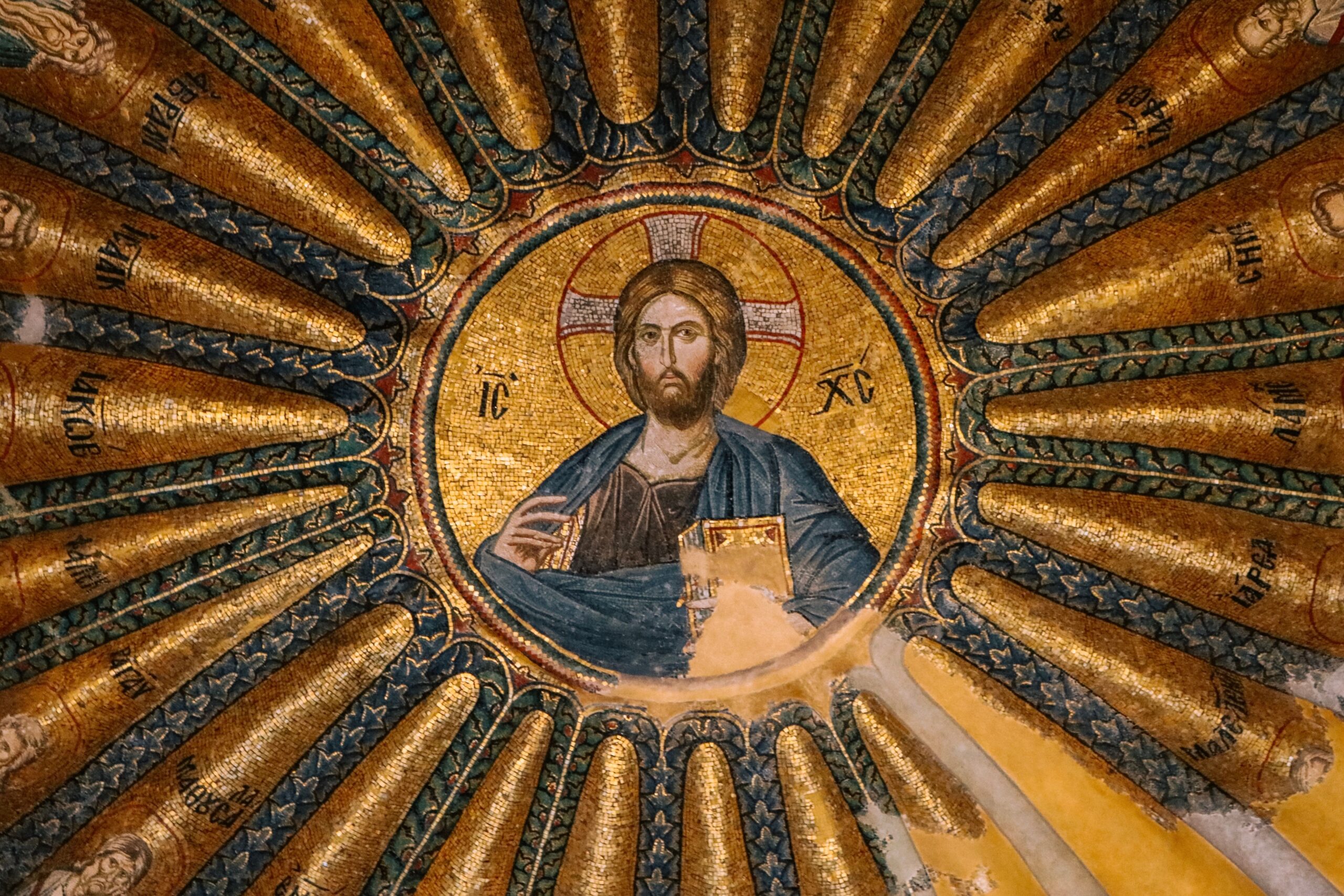 Detail of a Byzantine mosaic depicting Christ Pantocrator in a church dome.